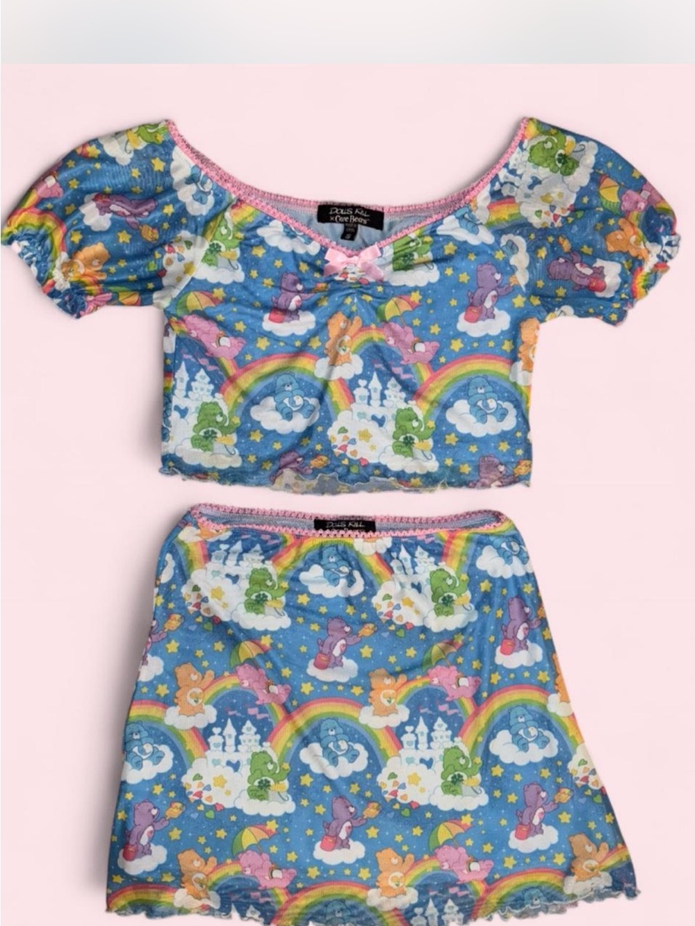 Dolls Kill x Care Bears Blue Rainbow Print Crop Top with Pink Trim
